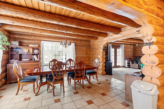 dining room featuring beam ceiling, log walls, wood ceiling, and an inviting chandelier