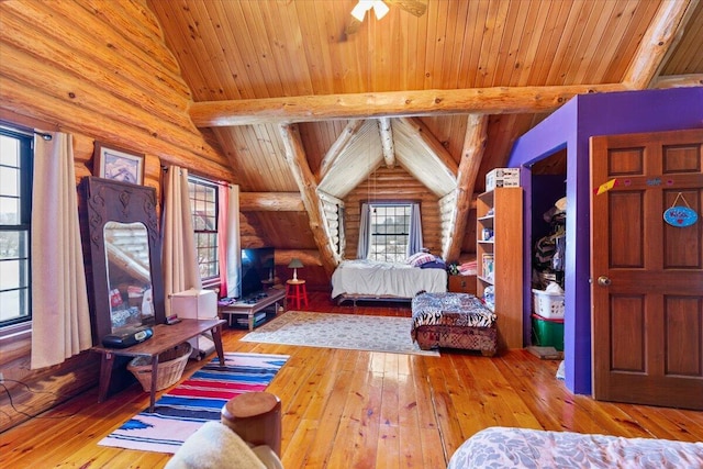 bedroom with log walls, vaulted ceiling with beams, light hardwood / wood-style flooring, and wooden ceiling