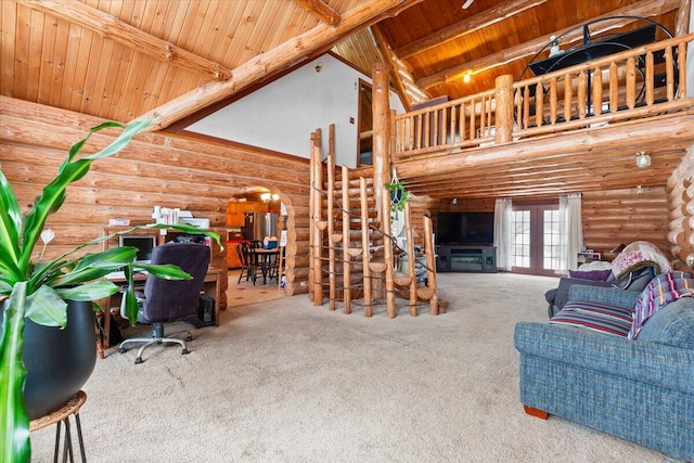 carpeted living room with high vaulted ceiling, beam ceiling, wood ceiling, and log walls