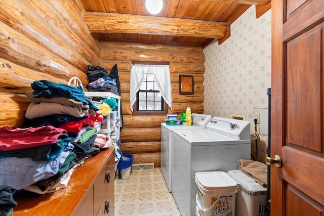 clothes washing area featuring log walls, separate washer and dryer, and wood ceiling