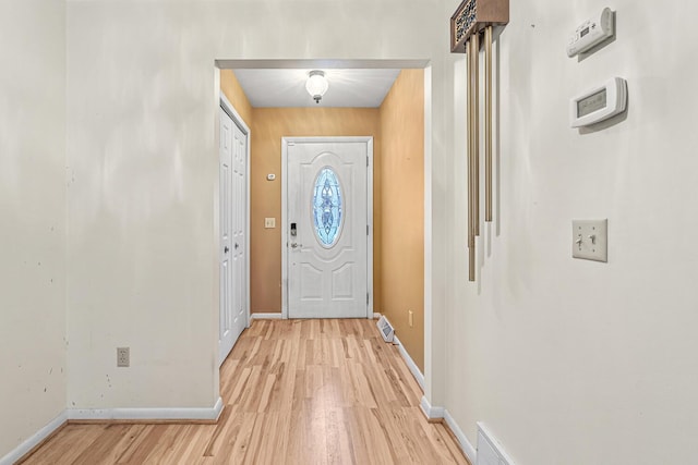 doorway to outside featuring light hardwood / wood-style flooring