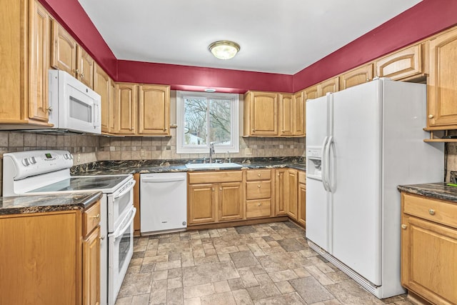 kitchen with white appliances, backsplash, and sink