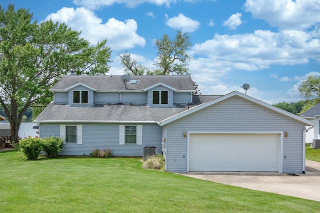 view of front facade featuring an attached garage, central air condition unit, concrete driveway, and a front yard