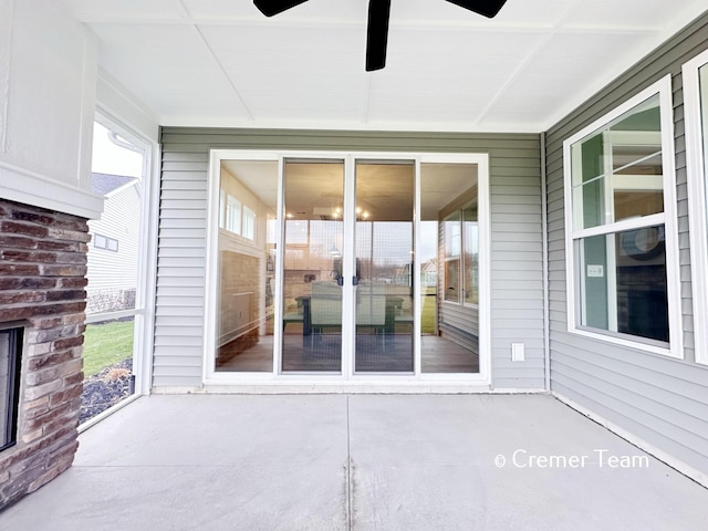 exterior space with ceiling fan