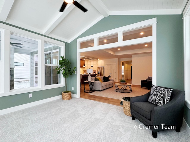 interior space with ceiling fan, vaulted ceiling with beams, and a healthy amount of sunlight