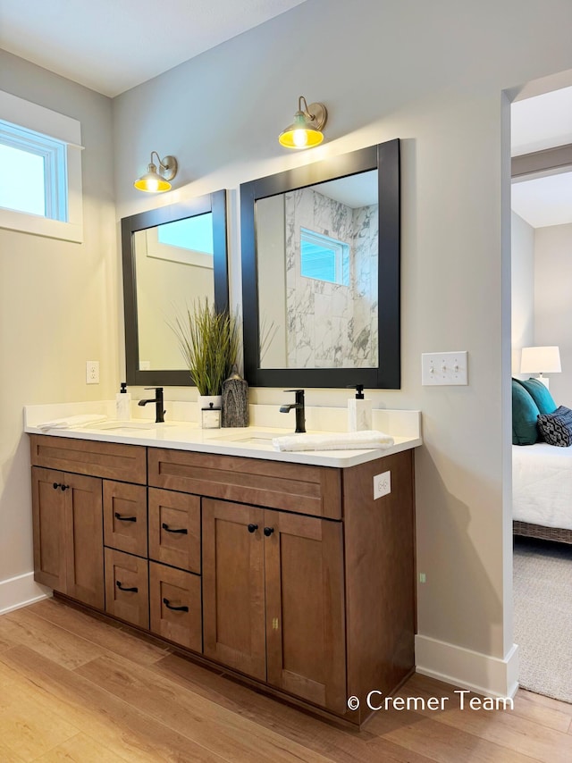 bathroom with hardwood / wood-style floors and vanity