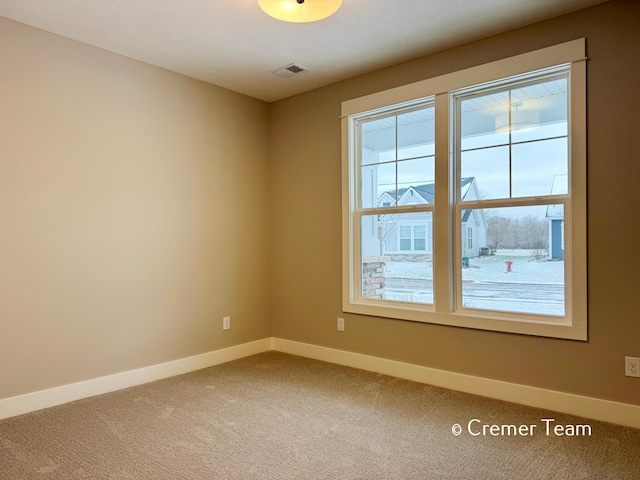 unfurnished room with carpet floors