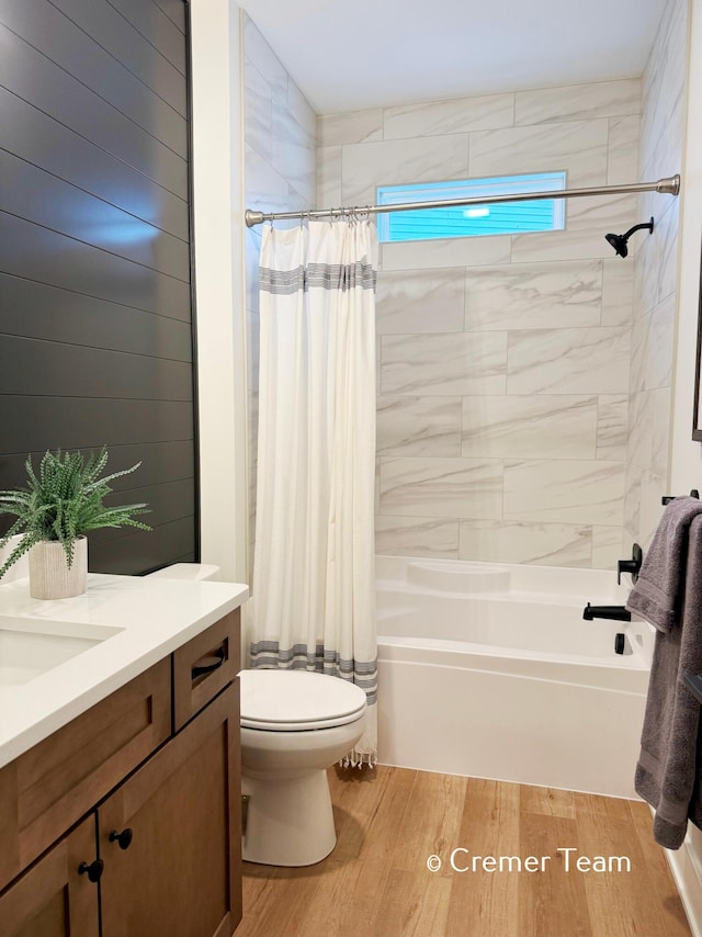 full bathroom with toilet, vanity, and shower / bathtub combination with curtain