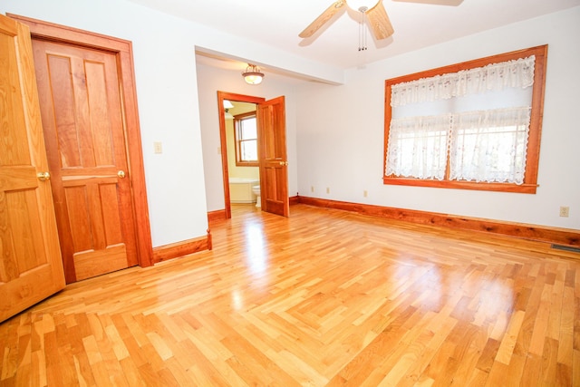 unfurnished bedroom featuring ceiling fan and light wood-type flooring