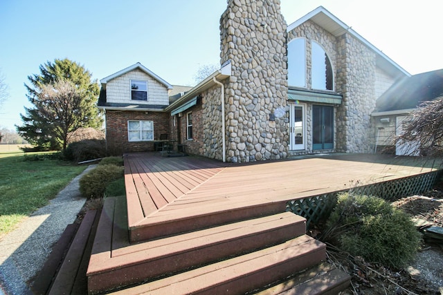 back of house with a wooden deck