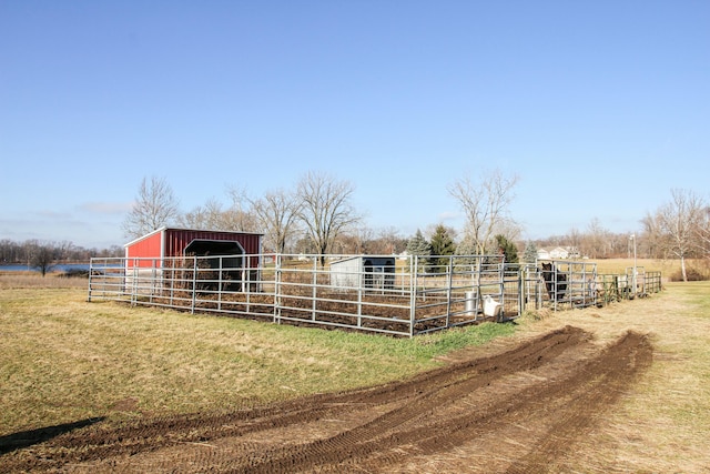 view of stable featuring a rural view