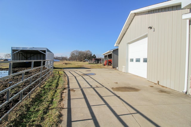 exterior space with an outbuilding and a garage