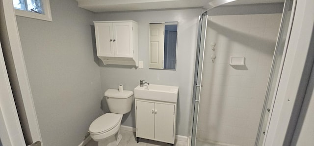 bathroom with walk in shower, vanity, and toilet