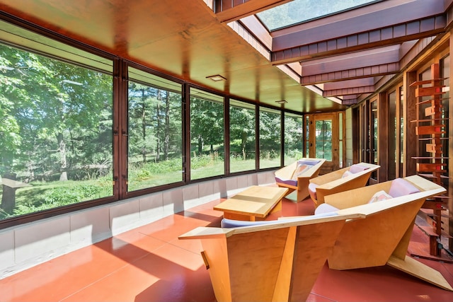 sunroom with a skylight and plenty of natural light