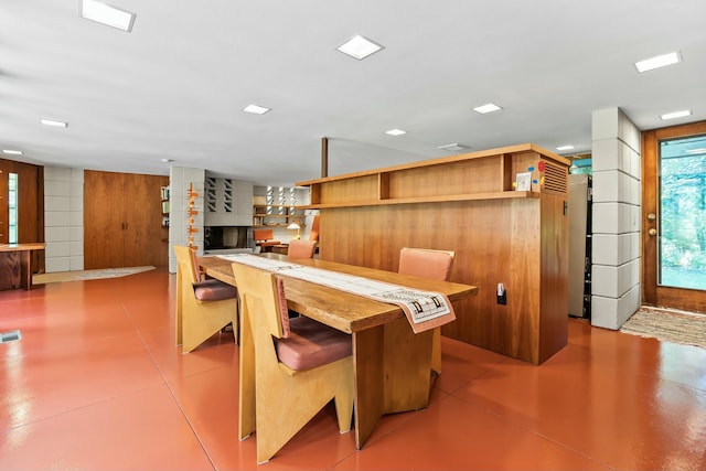 dining area with wood walls