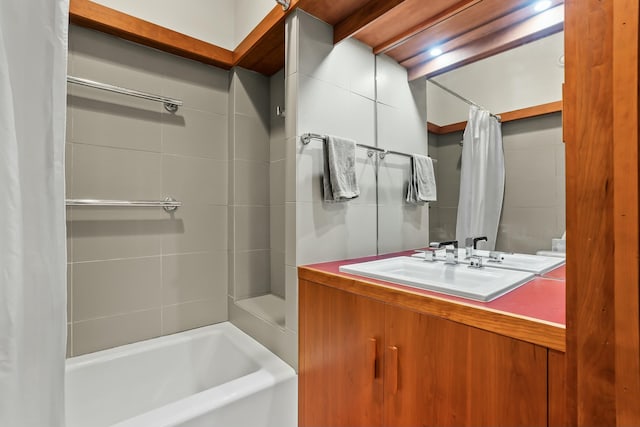 bathroom with sink and shower / bathtub combination with curtain