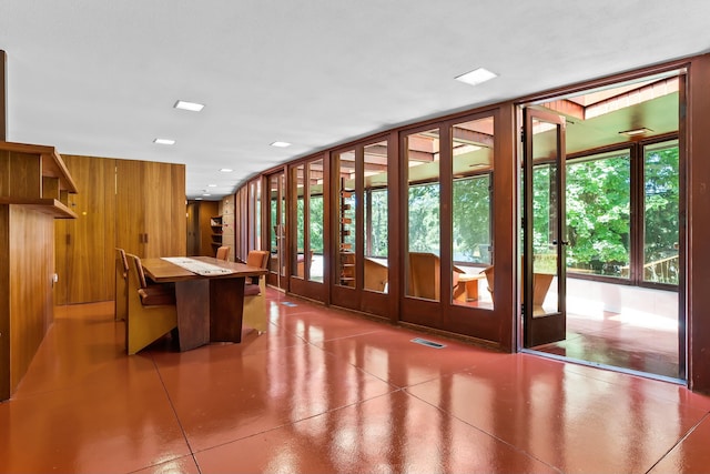 interior space featuring wooden walls