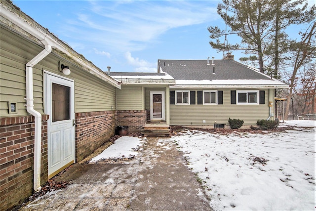 view of snow covered property