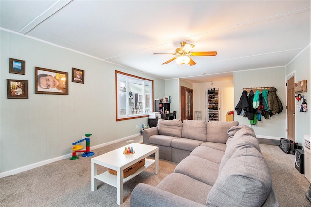 carpeted living room with ceiling fan