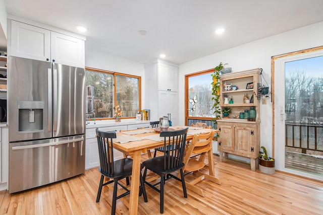 dining space with light wood-type flooring