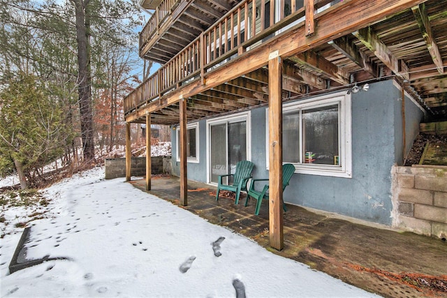 exterior space with a wooden deck and a patio area