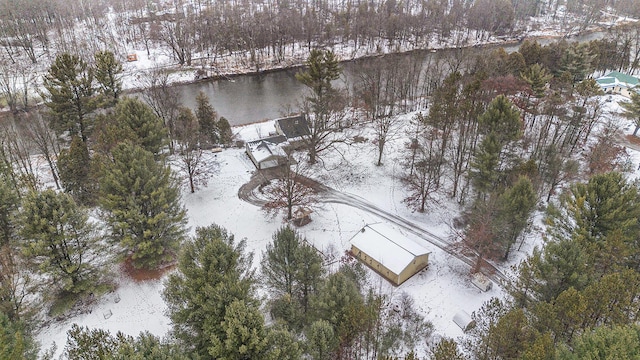 snowy aerial view with a water view