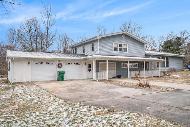 view of front facade featuring a porch and a garage