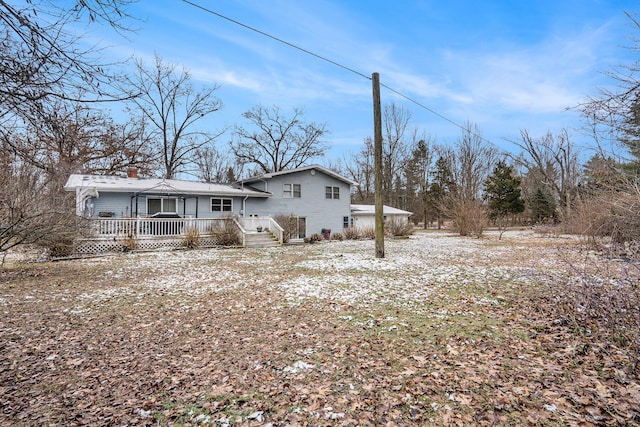 rear view of property with a deck