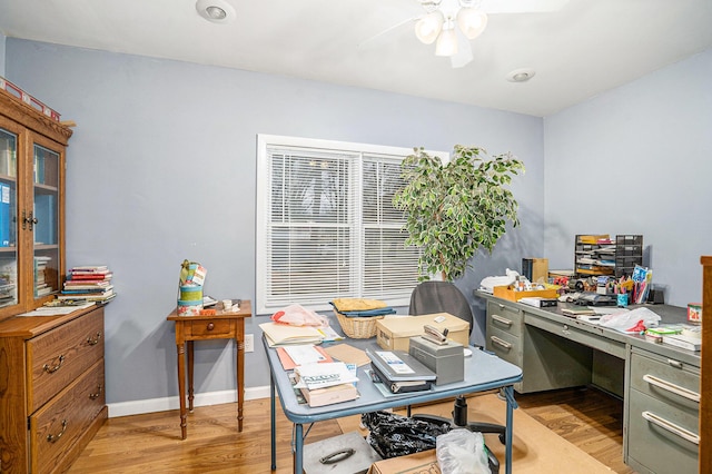 office area with light wood-type flooring and ceiling fan