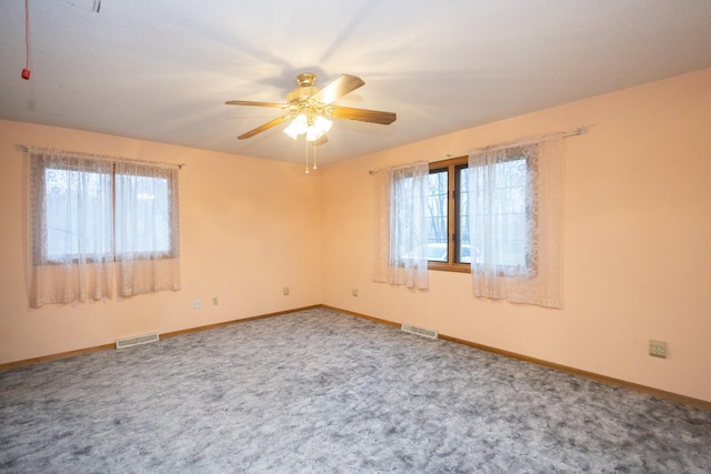 carpeted empty room with ceiling fan