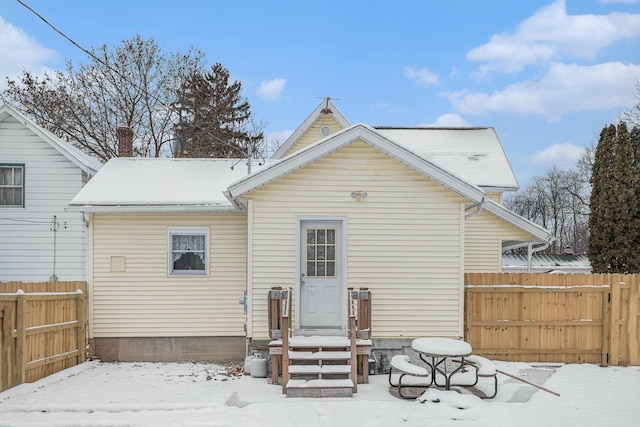 view of snow covered house