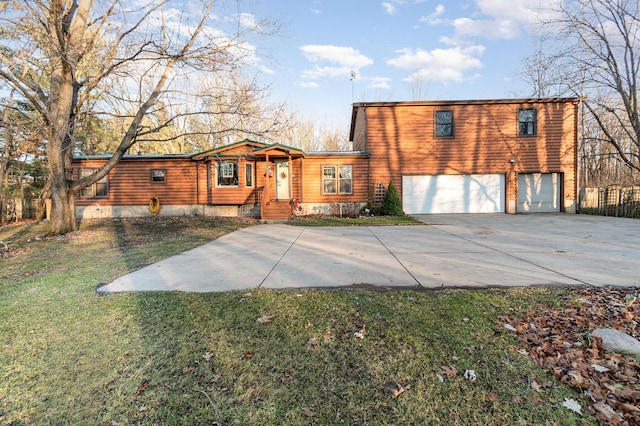 view of front of house featuring a garage and a front yard