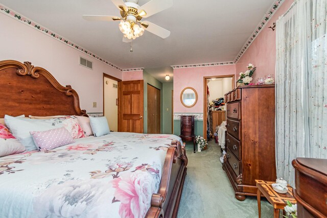 carpeted bedroom with ceiling fan