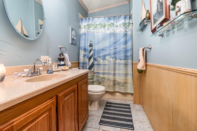 full bathroom with tile patterned flooring, crown molding, a textured ceiling, vaulted ceiling, and vanity