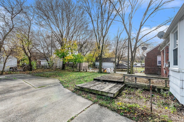 view of yard with a wooden deck