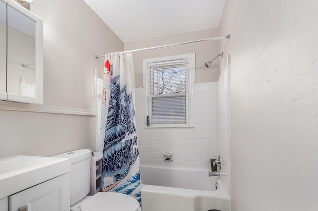 full bathroom featuring vanity, shower / bath combination with curtain, and toilet