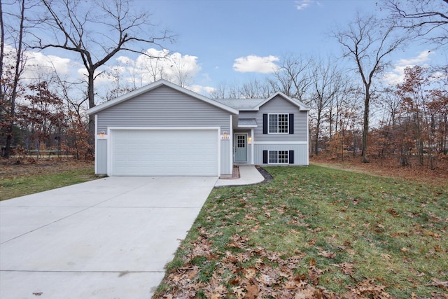 view of front of house with a front lawn and a garage