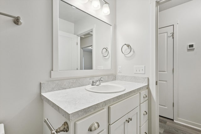 bathroom featuring vanity and hardwood / wood-style flooring