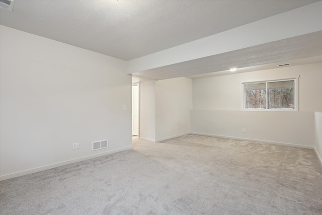 empty room featuring light colored carpet