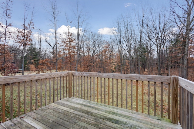 wooden deck with a lawn