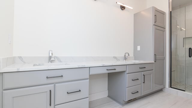 bathroom with vanity and an enclosed shower