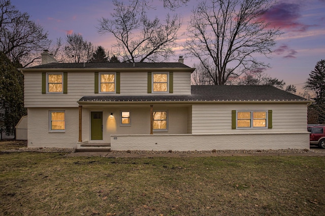 view of front of property with a yard