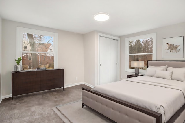 bedroom featuring carpet flooring and a closet