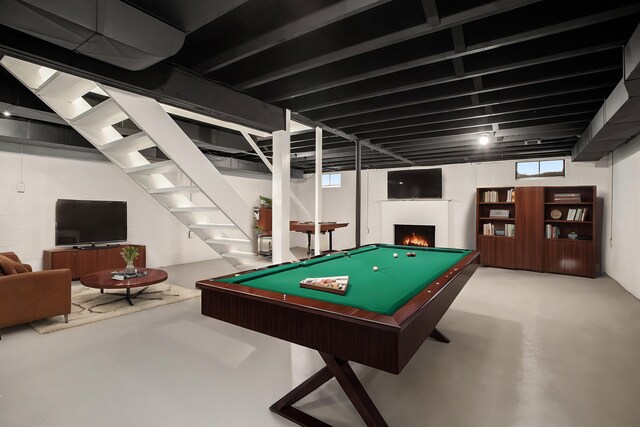 playroom with concrete flooring and billiards