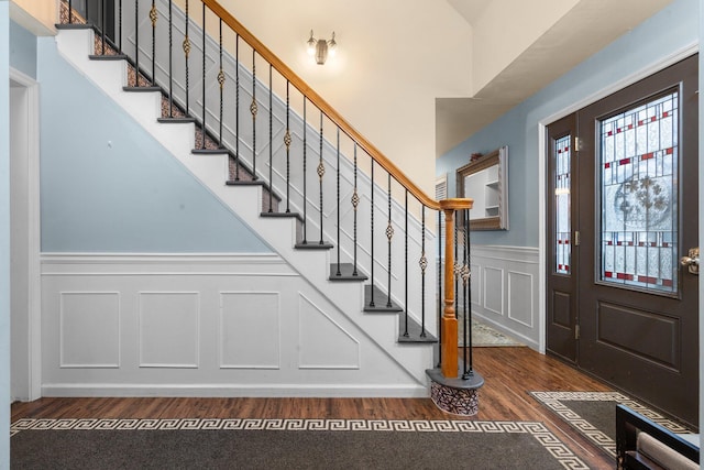 foyer entrance featuring dark hardwood / wood-style floors