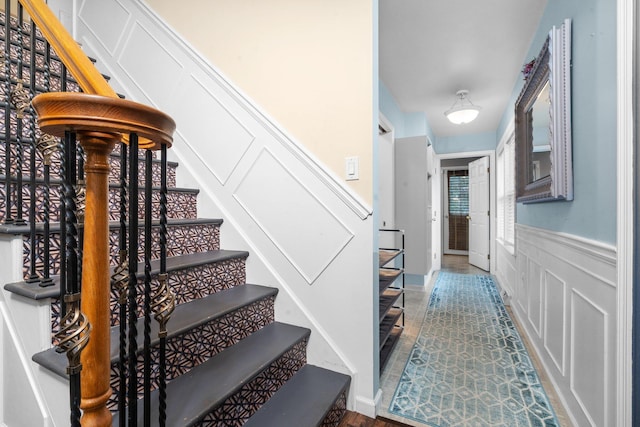 staircase with tile patterned floors