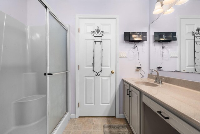 bathroom with vanity and an enclosed shower