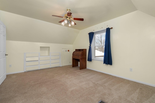 bonus room featuring light carpet, ceiling fan, and vaulted ceiling