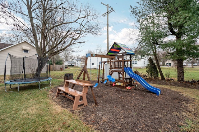 view of playground with a lawn and a trampoline