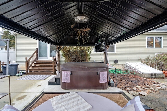 view of patio / terrace with a hot tub